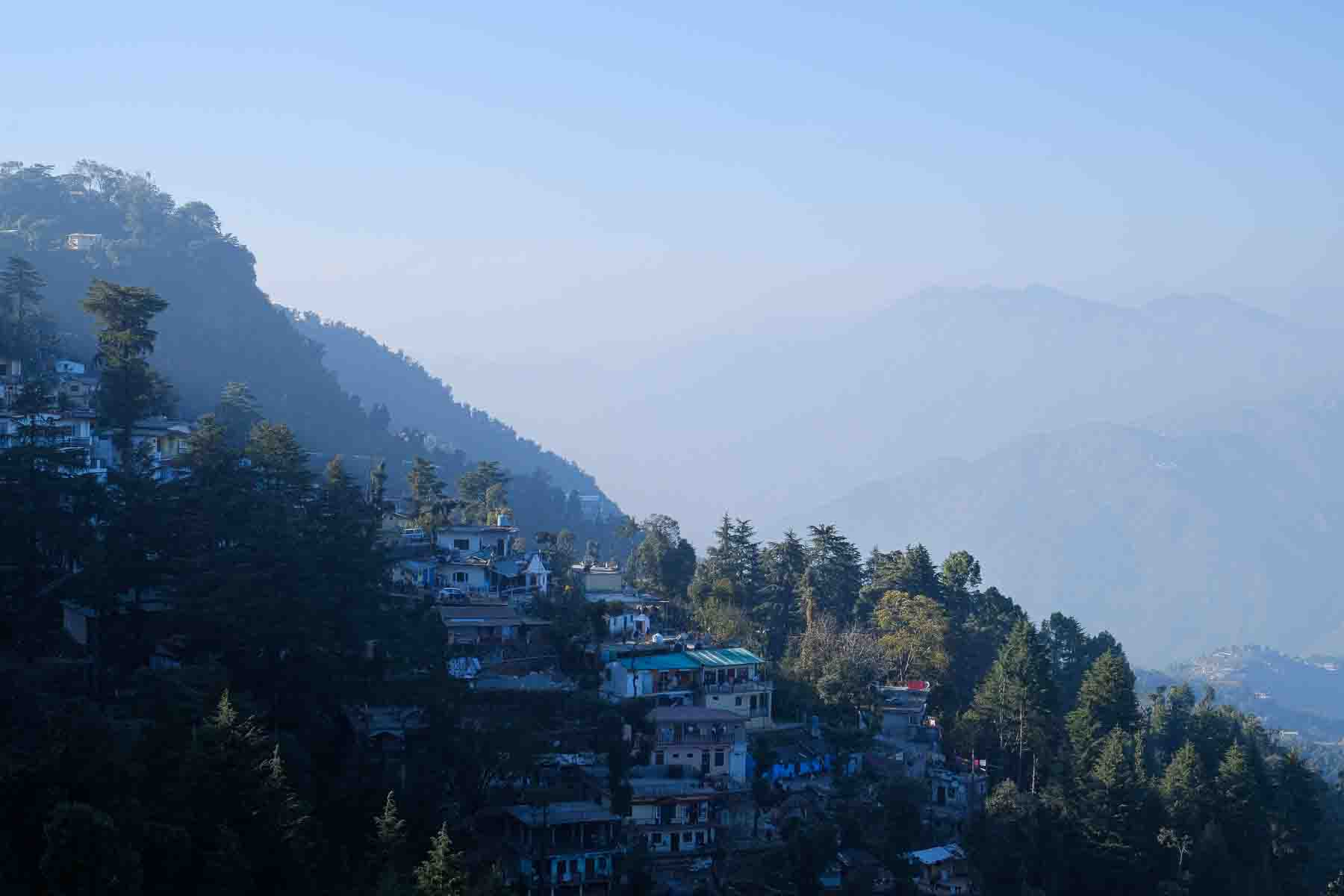Hillside houses stacked along the Himalayan foothills